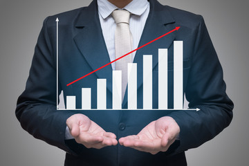 Businessman standing posture hand holding graph finance