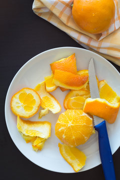 Orange Peeled with Knife for Cutting into Segments