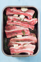 Seasoned Raw Spareribs with Rosemary and Thyme in Baking Form