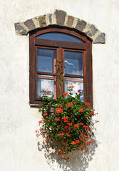 Fototapeta na wymiar Wooden window casement of an old building
