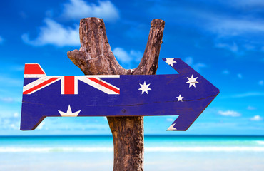 Australia Flag wooden sign with a beach on background