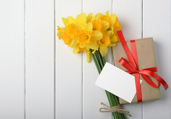 daffodils with a gift box
