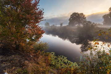 Morning on the bank of autumn lake