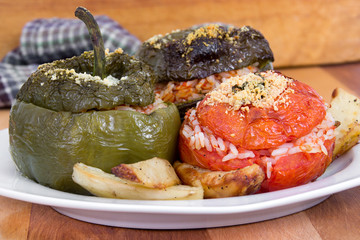 Stuffed pepper and tomato with rice and parmesan cheese