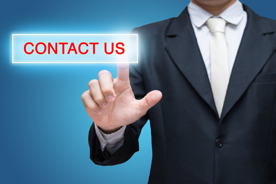 Businessman pressing contact us button isolated