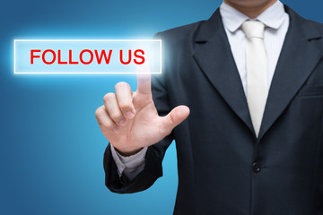 Businessman pressing follow us button isolated