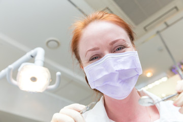Good dentist with mirror and probe closeup