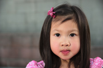 Asian female child in pink dress