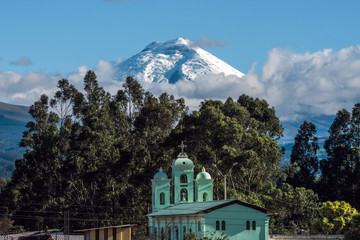 Cotopaxi volcano over the San Jaloma Church and Village, Andes © Kseniya Ragozina