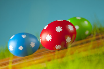 Colored Easter eggs on the grass