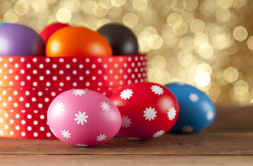 Colored Easter eggs on gold background