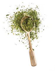 dried parsley in a spoon