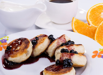 Delicious sweet cottage cheese pancakes with currant jam