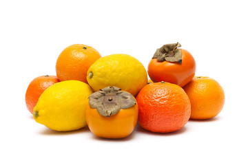 persimmons, tangerines and lemons isolated on white background