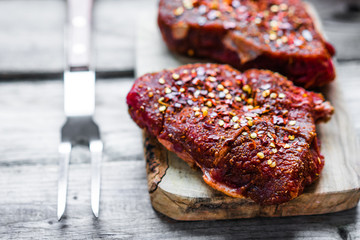 Raw meat on wooden background