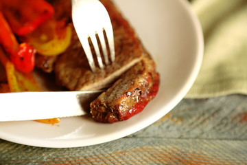 Composition with tasty roasted meat and vegetables