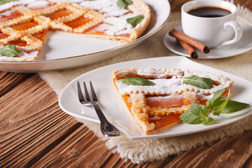 Italian tart with apricot jam and coffee. horizontal