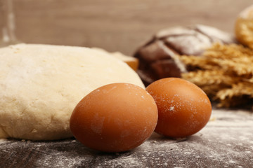Making bread on table and wooden background