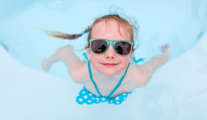 Little girl in swimming pool