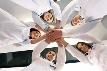 United hands of medical team close up