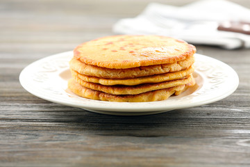 Tasty fritters on plate on table close up
