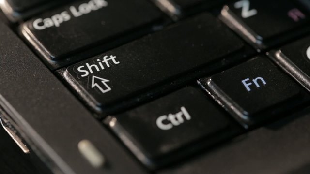 Computer keyboard keys melted high temperature. Shift Ctrl Fn