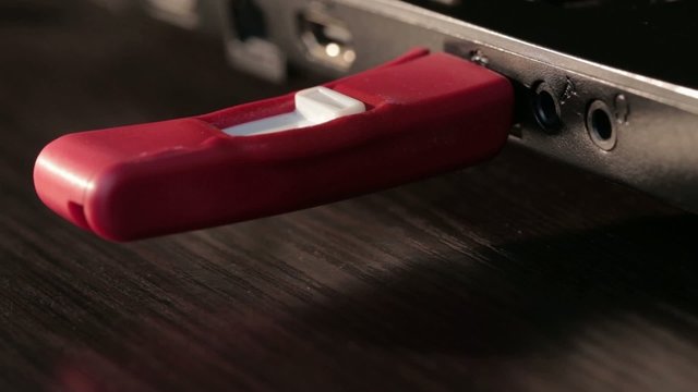 Computer red USB flash drive disk connected melted by high