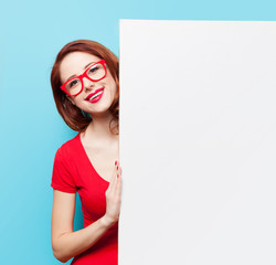 girl in red dress and glasses with white board