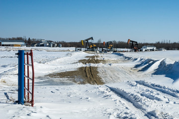 Service road to an oil well in winter