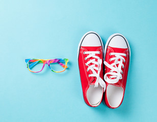  gumshoes with white shoelaces and glasses