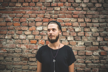 Obraz premium young handsome bearded hipster man