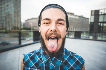 young handsome bearded hipster man - obrazy, fototapety, plakaty