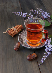 cup of tea, cinnamon, anise, teapot and flowers