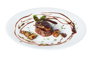 Meat with potetos on a white plate