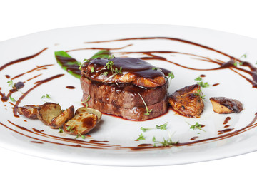 Meat with potetos on a white plate