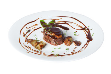 Meat with potetos on a white plate