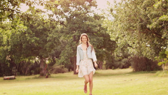 In slow motion hopping girl in the park