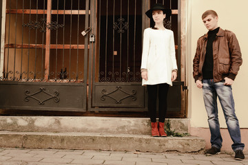 modern couple of hipsters in love walk on European streets