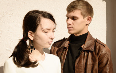 modern couple of hipsters in love walk on European streets