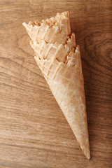 empty ice cream cones on wooden background