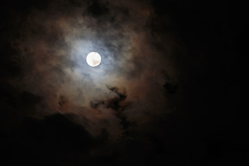 Fototapeta na wymiar Blurred - dark stormy sky with moon