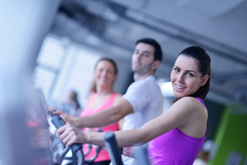 Fototapeta premium Group of people running on treadmills