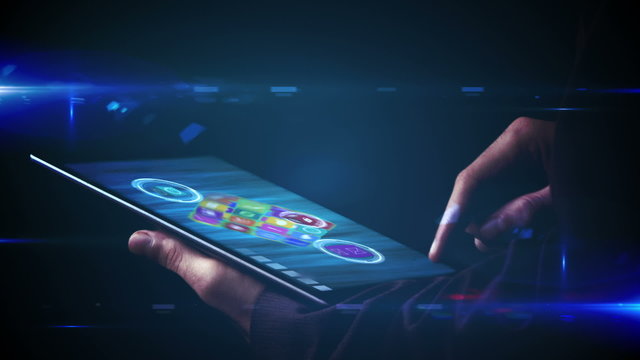 Businessman using tablet to view holographic apps