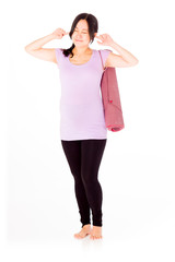 Fototapeta premium Pregnant asian woman isolated on white pluging her hears