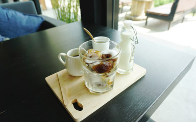 Ice latte coffee serving on timber block