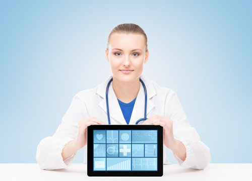 Young and professional woman doctor with an ipad