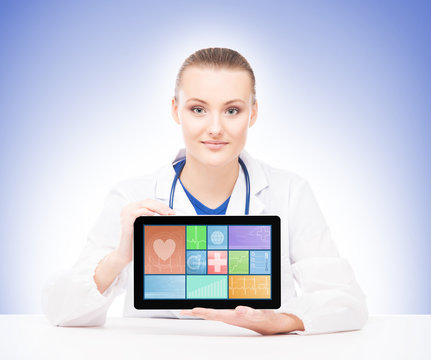 Young and professional woman doctor with a tablet