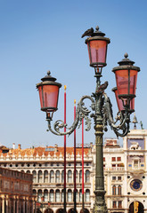 Fototapeta na wymiar Lantern over Clock Tower in Venice. Italy