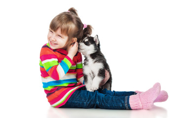 Fototapeta na wymiar Girl with a puppy, isolated on white background