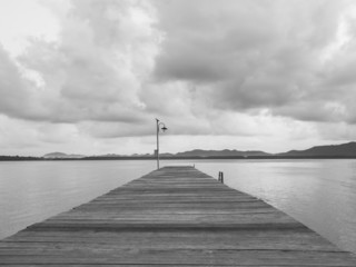 Pier with sea and Cloudy sky black and white